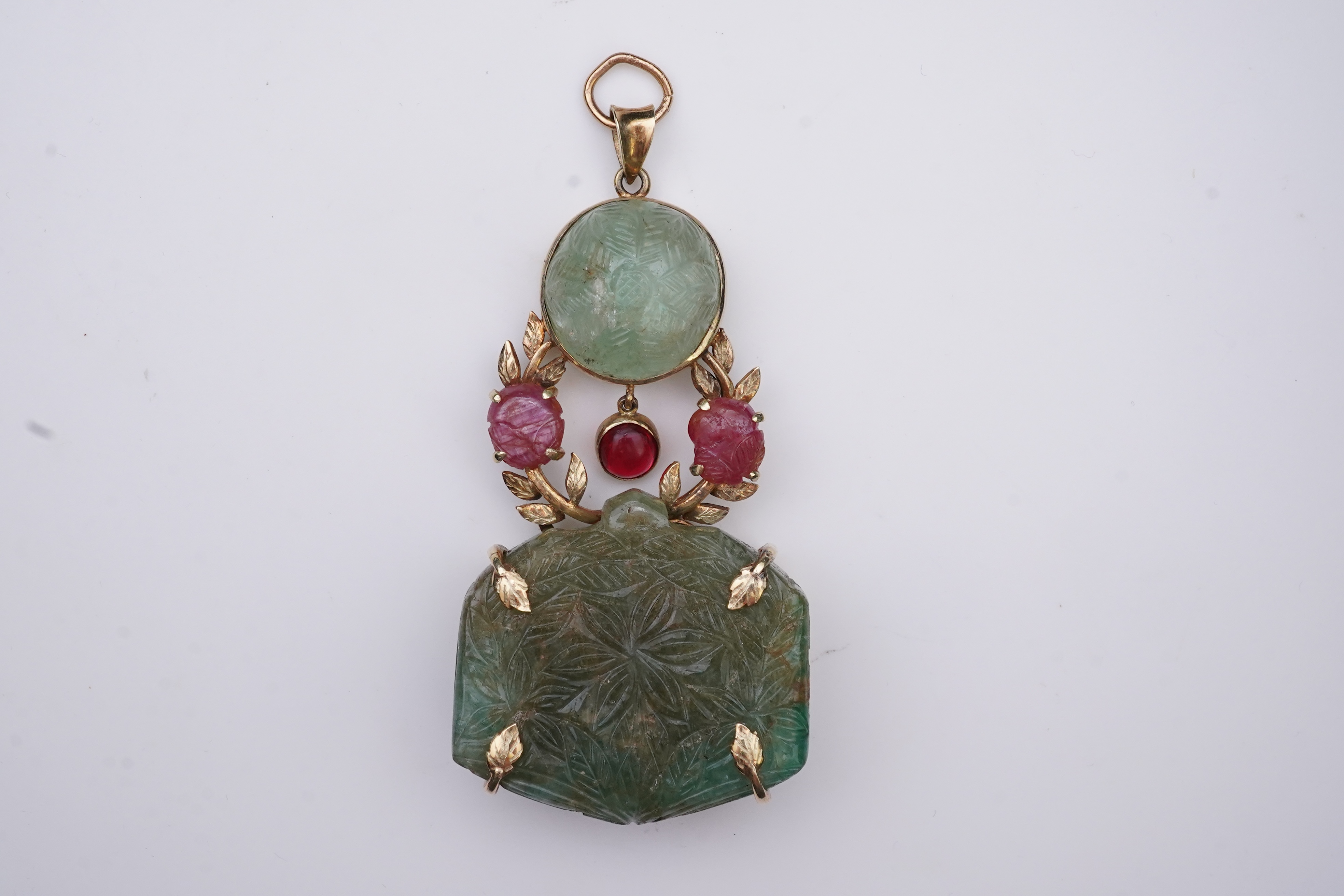 An unusual Mughal-style emerald, ruby and synthetic ruby pendant, second half 20th century